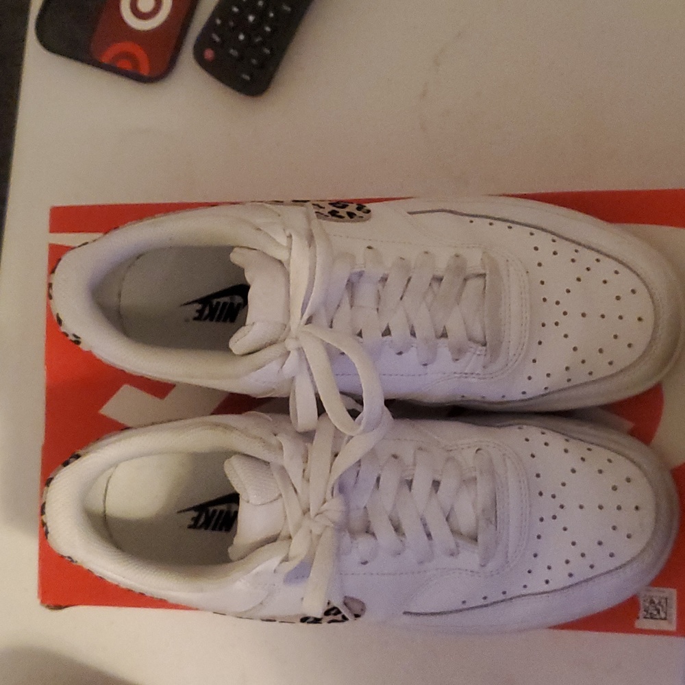Womens White  Nike sneakers with tan black gray print on the side